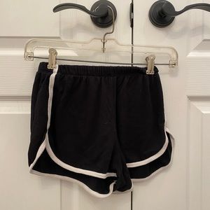 Black fabric shorts with white trim